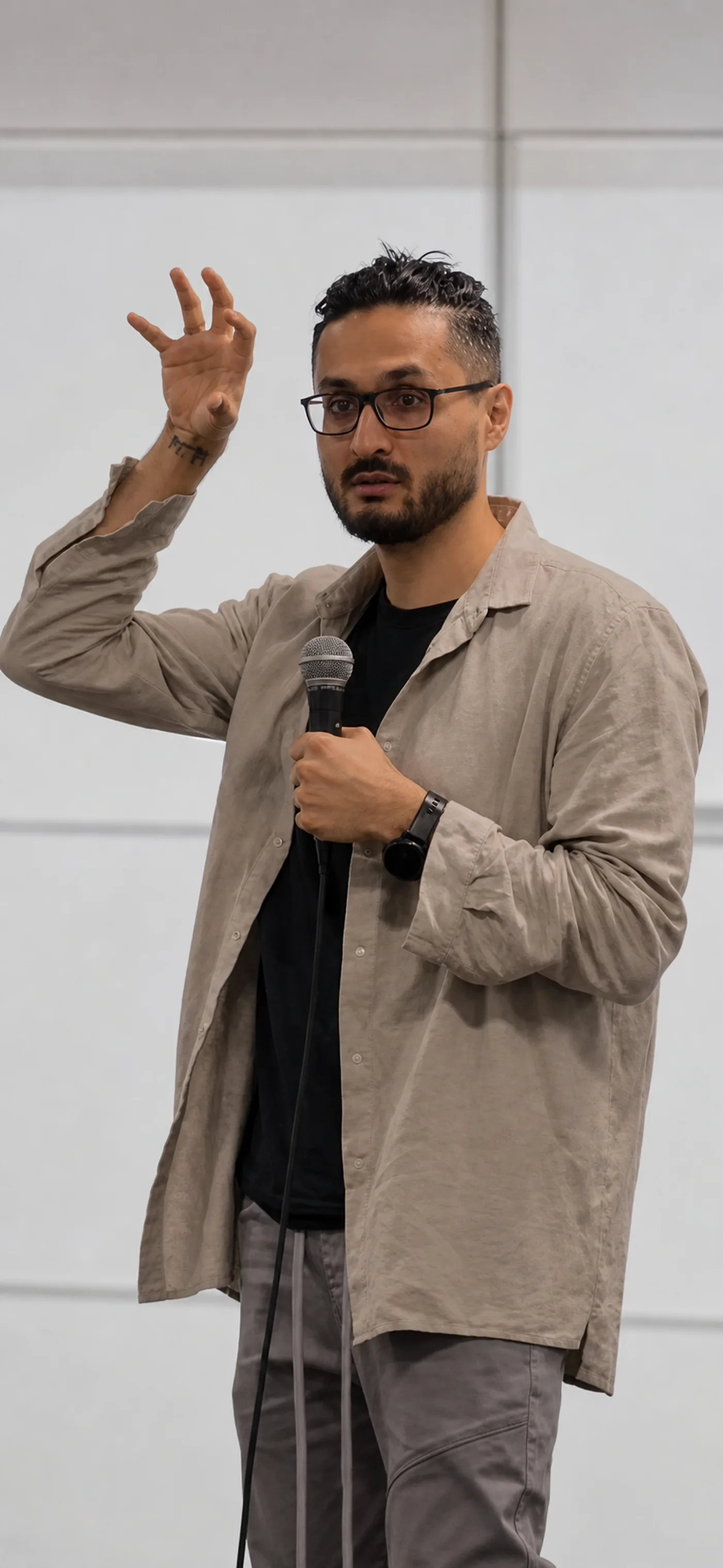 Azamat speaking about AI workflow for CEOs